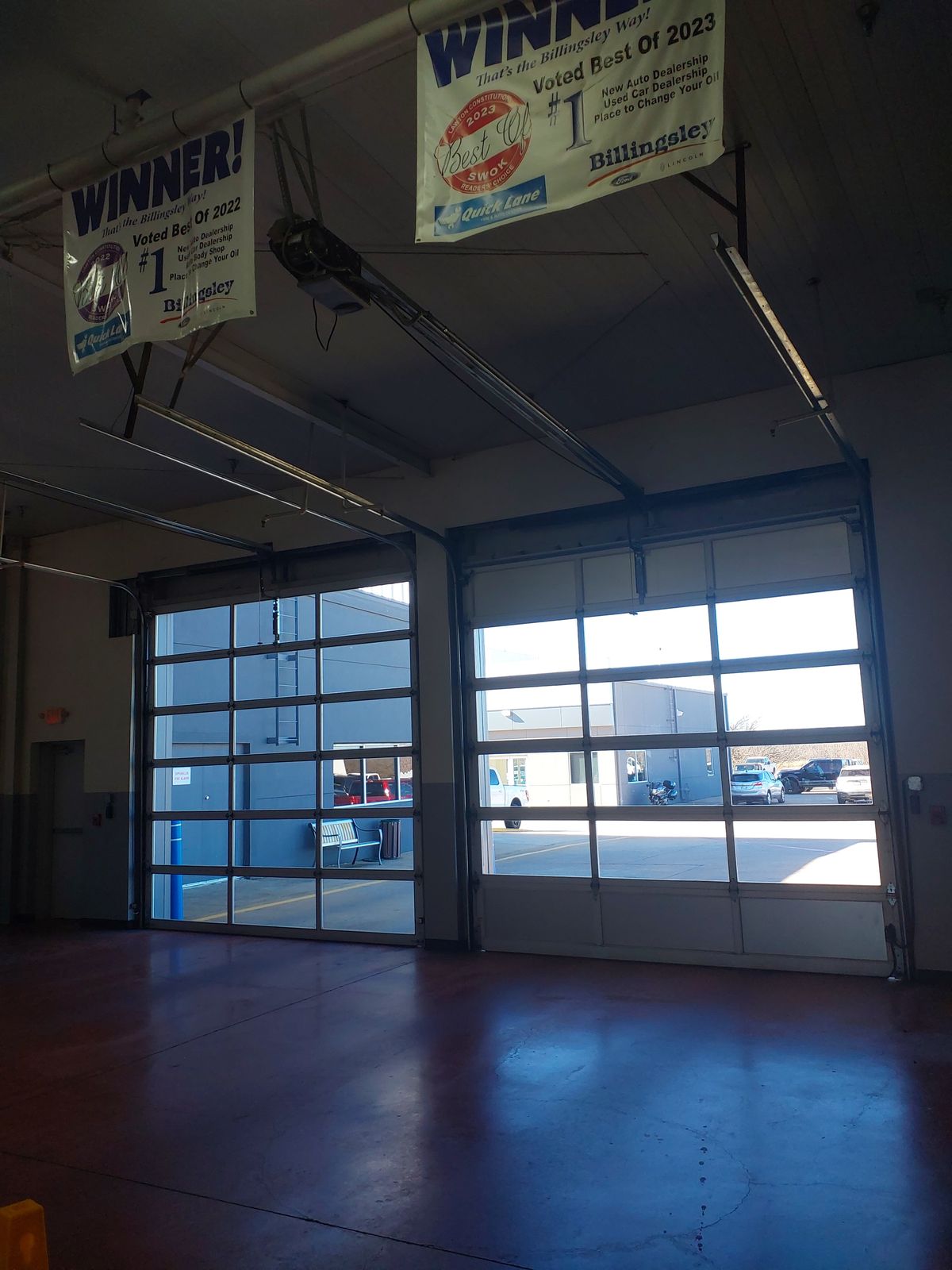 Full-view commercial glass doors installed at a Lawton dealership