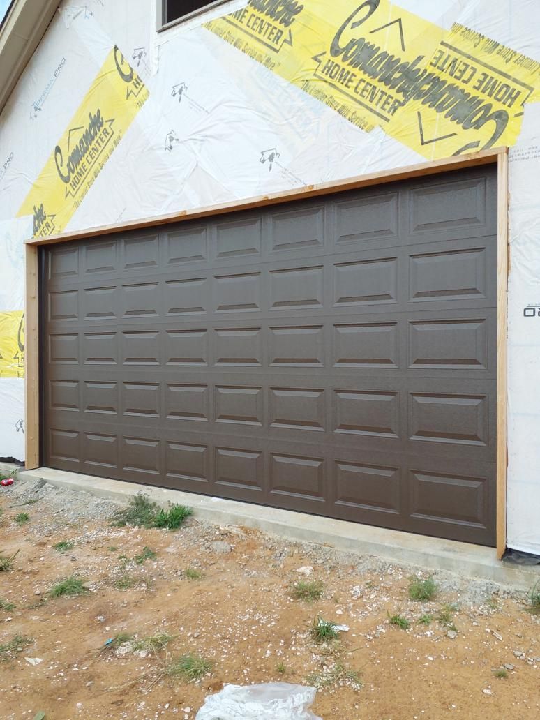 New garage door and opener installed during construction